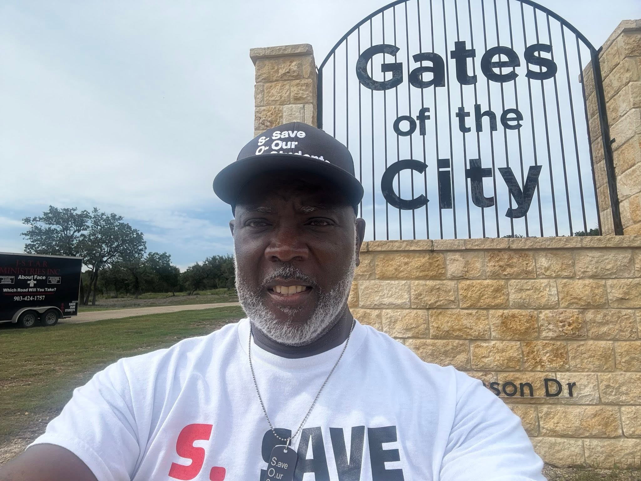Patrick outside Gates of the City Church in Kerrville, with the J-STAR relief trailer behind him.