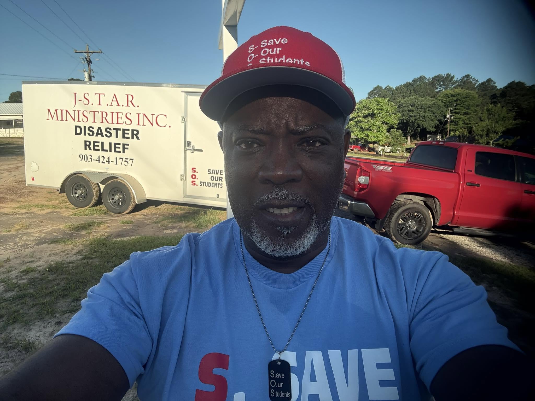 Patrick Johnson in front of his truck and J-STAR disaster relief trailer.