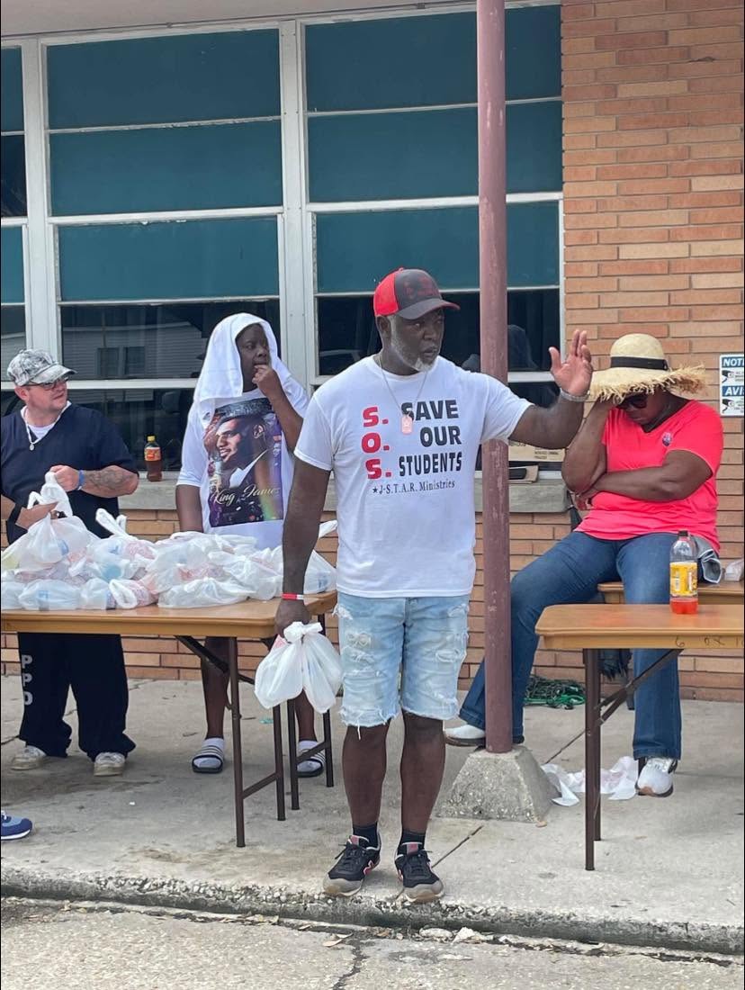 Patrick with bagged supplies during the Hurricane Francine response in Patterson.
