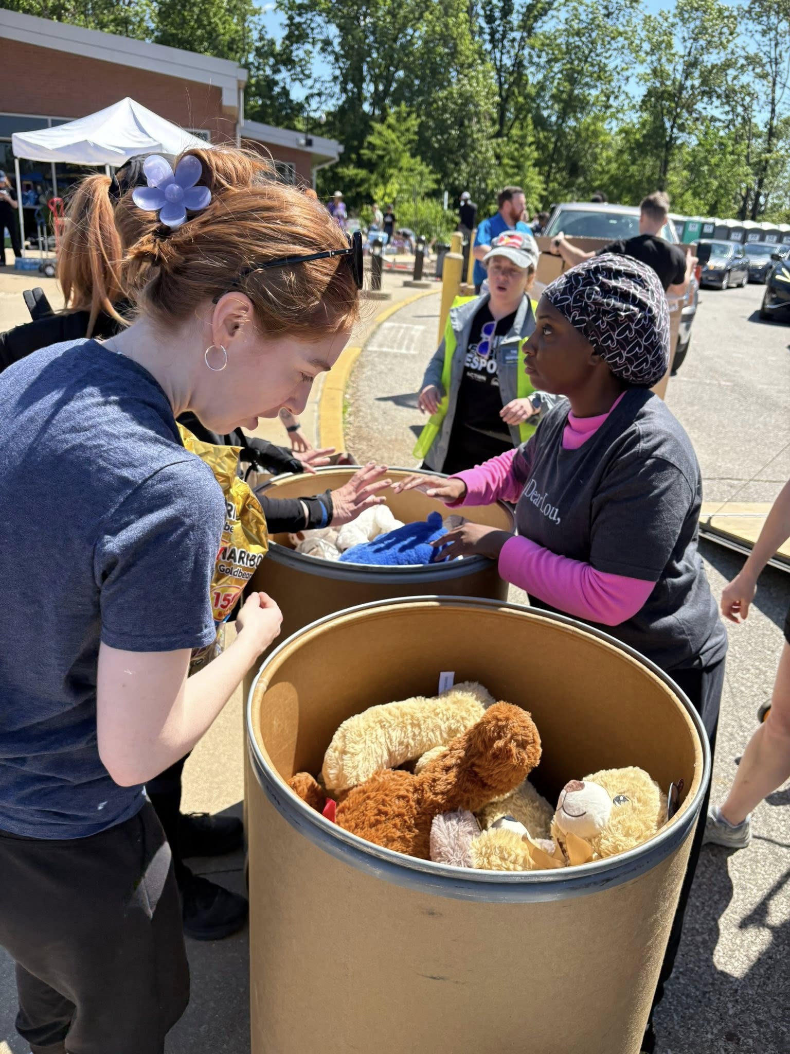 Volunteers distribute stuffed animals and supplies during the St. Louis tornado response.