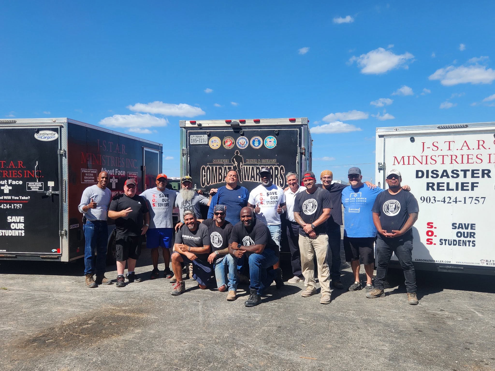 Patrick and the relief team beside J-STAR and partner trailers during Trip #71.