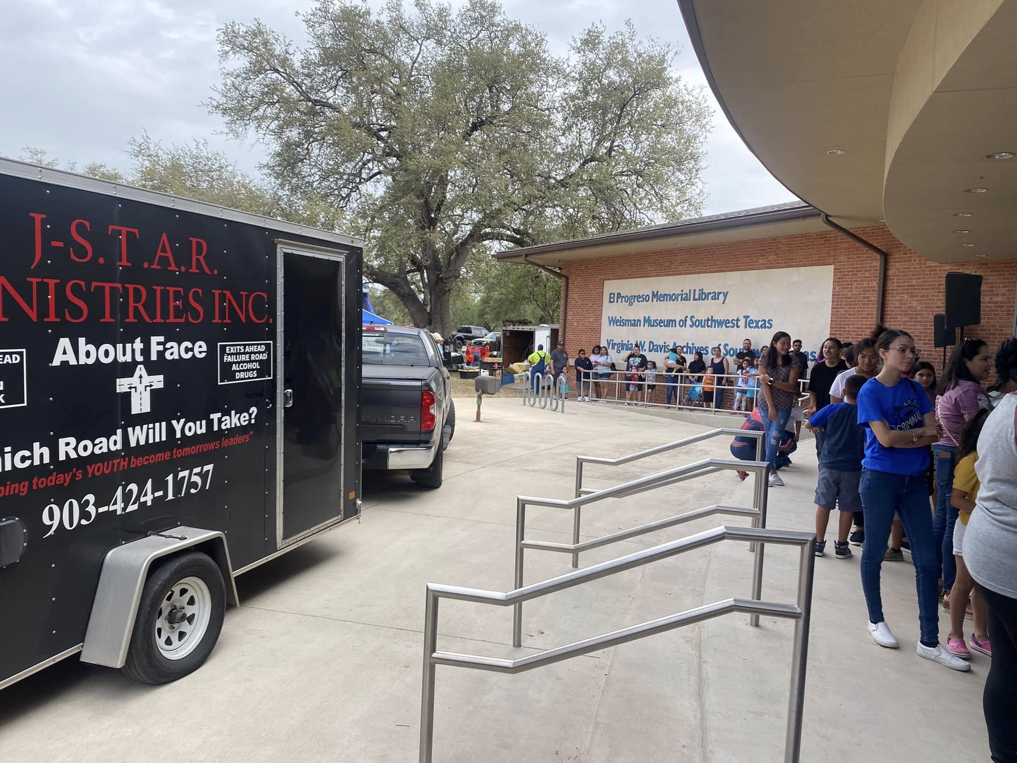 J-STAR Ministries' branded trailer outside El Progreso Memorial Library in Uvalde as local families gather.
